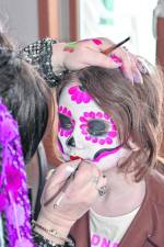 Kerry Tobin of Pixie Shop paints a face at April Fool’s Family Fun Day on Saturday, April 6 at the Upper Greenwood Lake Clubhouse. (Photo by Rich Adamonis)