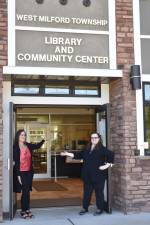 Karyn Gost, left, became director of the West Milford Township Library and Community Center a year ago. With her is Theresa McArthur, the supervising librarian. (Photo by Rich Adamonis)