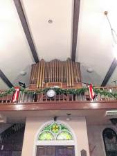 The old pipe organ at St. Joseph’s Church remains and can be played. (Photo by Bill Marra)