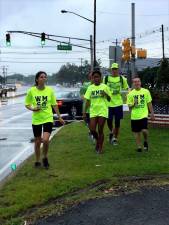 Heather Gerety, Destiny Gerety and Michael McCloskey, all West Milford Special Olympics athletes, run with Kyle Lang through northern New Jersey. photo by kristi clave