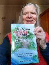 West Milford resident Mary Beth Osiecki holds her book, ‘Welcome Inn Christmas: An Invitation to Prayer through Illustrated Poetry.’ (Photo provided)