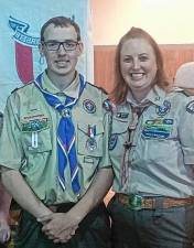 Robbie Woods, an Eagle Scout in 2017, became an assistant scoutmaster of Troop 159. At right is Betsy Person, then the advancement chairwoman for Troop 159. (Photos provided)