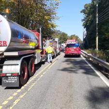 Fire crews work on an accident involving a home-heating oil truck on Friday in West Milford.