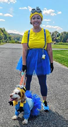 Dog Walk raises money for shelter A dog and her owner dress up for the West Milford Animal Shelter Society’s annual Dog Walk at Wawayanda State Park in Hewitt. The event includes a costume contest.