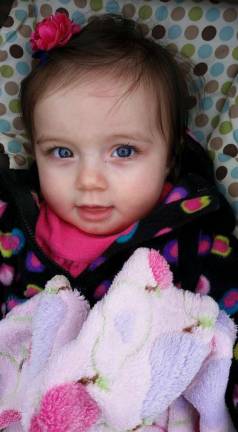 Oh Baby it's Spring! Baby Photo Contest Photo, Jodi Spatola of Randolph "Brielle had a great time welcoming Spring at the park! She especially enjoying watching her Big Sister on the swing."