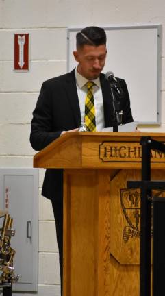 Brian McLaughlin, the director of bands at West Milford High School since 2004, introduces the performers.