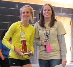 Alyssa Douma, left, receives her trophy from her best friend, Race Director Deirdre Bough. Douma was the first female finisher and the second overall.