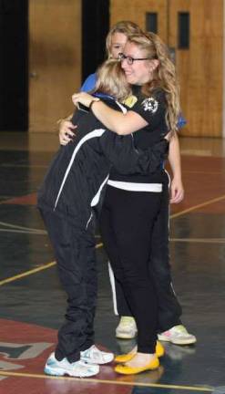 Photos by Patricia Keller Coach Kristi Masone hugs participant Meghan O'Neil.&quot;She was crying because she was so excited about her award!&quot; said Masone.