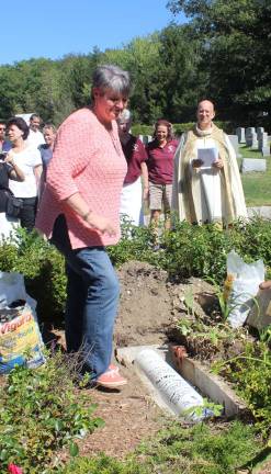 St. Joseph's jubilee year comes to a close Jubilee committee member Paula Korinko and other parishioners view the 250th time capsule as Fr. Steven Shadwell is about to give the blessing.