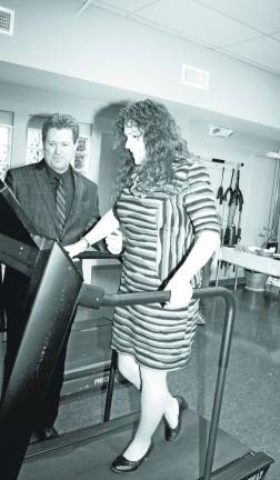 West Milford Physical Therapy Center relocates to Bald Eagle Commons Always a good sport, West Milford Mayor Bettina Bieri hopped on the treadmill, even in heels. With the mayor is Sean Kane, physical therapist and co-owner of West Milford Physical Therapy Center.
