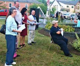 [Township Council members Marylin Lichtenberg, Patricia Gerst, Peter McGuinness, Andie Pegel, Lou Signorino, and Ada Erik attend the 9/11 Memorial Service in front of Town Hall Wednesday night minutes after adopting the 2019 budget. Charles Kim photo]