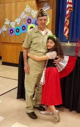 Robert Myshkoff, United States Air Force E4 Sergeant, was honored by Maple Road third graders at their international night. Pictured with him is his granddaughter, Marina Petrosillo.