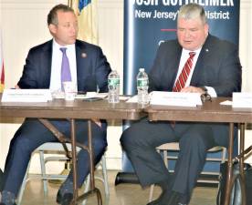 U. S. Rep. Josh Gottheimer, left, and state Sen. Steven Oroho discuss power outages during a forum in Ogdensburg on Tuesday.