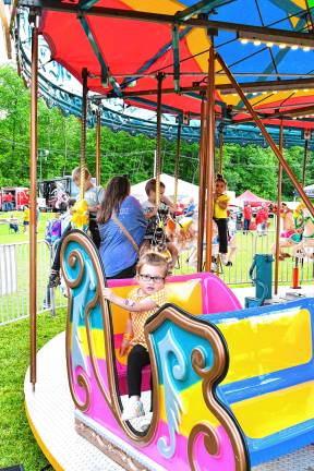Photos: Firemen’s Carnival Penelope Ruvo rides the merry-go-round Friday, May 30 at the Firemen’s Carnival in Oak Ridge. (Photos by Maria Kovic)