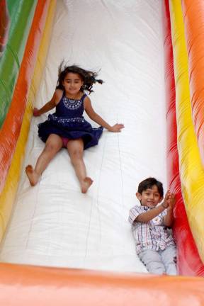 A celebration of Mary Photos by Ginny Raue Kids enjoy the slide during the celebration of Santa Maria at the Panagia Soumela Chapel and Cultural Center in West Milford.