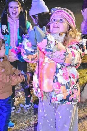 Celebrate the season Children catch flakes from the snow-making machines at the annual Christmas Tree Lighting Ceremony on Monday, Dec. 2 in front of the West Milford municipal building. (Photo by Rich Adamonis)