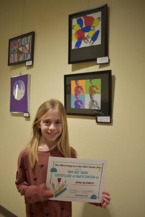 Emma Seltenrich of Apshawa Elementary School with her artwork (top frame).
