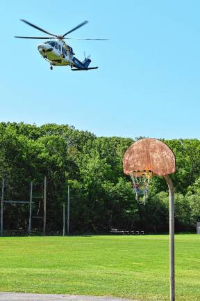 Simulated crash meant as warning A New Jersey State Police medevac helicopter arrives at the high school.
