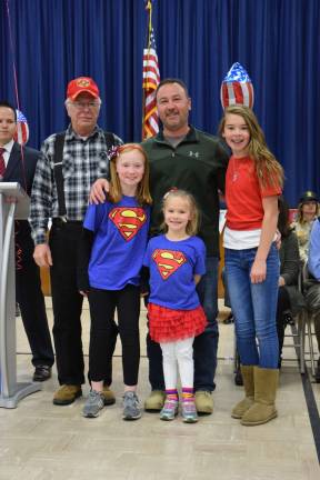 Front from left, Students Mattie, Leah and Katie Ralicki participated in the Upper Greenwood Lake School's Veterans Day ceremony. At left is their uncle, John Garb, with their dad, Matthew Ralicki, both veterans.