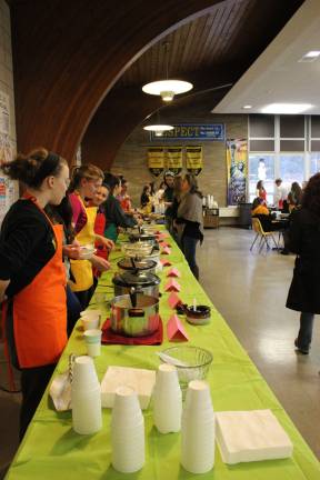 Ready to serve - Volunteers are ready to serve the dozen varieties of homemade soup that were available at Empty Bowls.