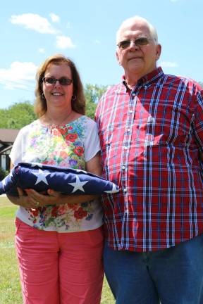 A fitting farewell for an American patriot Photos by Don Webb Kathy Brown with husband Darryl proudly hold flag that was given to them in memory of Kathy's dad, Eric John Vonderhorst at his memorial service last Sunday.