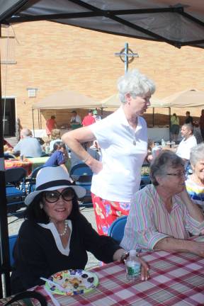 St. Joseph Church welcomes new priest at annual parish picnic From left, Noreen Ferriter, Sr. Janet Brisky and Judy Salvatore chat with their friends at the picnic.