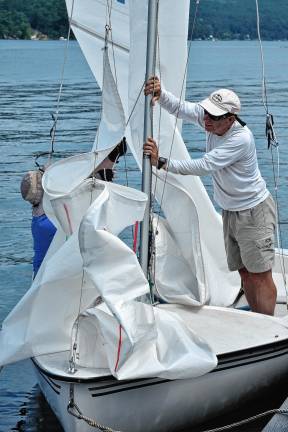 Regatta features strong competition A Rebel racing team readies sails for the final race Saturday, July 12.