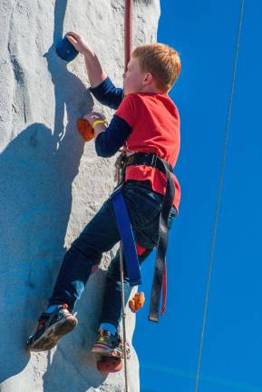 Awesome ALF Many kids gave their best to climb the rock wall.