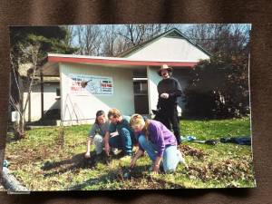 In the early days of the Church of the Incarnation on Marshall Hill Road, some parishioners plant a flower garden. (File photo by Ann Genader)