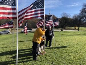 RF1 West Milford Rotary Club members, from left, Bob Asaro, Karen Sabyan and Gery Threlfall place American flags at Bubbling Springs on Friday, Nov. 3. Also helping with the project were Chris Garcia, Cindy LeMay, Tom Ziegenbalg, Ken Quazza, Brian Murphy and David LeMay. (Photo by Kathy Shwiff)