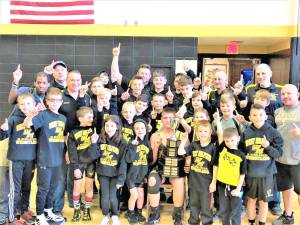 Junior wrestlers win first trophy of season at home
