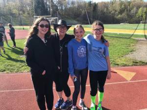 Lauren Frey, Emily Coppola, 14, and Olivia Schmelz, 13, both of West Milford are pictured with their Girls on the Run Coach Donna Jean Neill at their practice 5K.