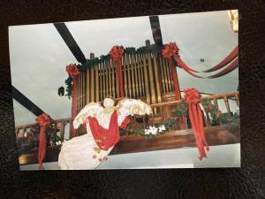 Until recent years, music at St. Joseph Church in West Milford came from the pipe organ. Near it is a papier-mâché angel created by Father Bernie. (File photo by Ann Genader)
