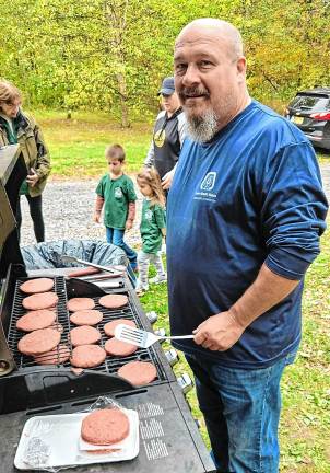 Volunteers clean up roadsides JB2 Councilman Kevin Goodsir cooks burgers for the picnic for volunteers on Autumn Pride Roadside Litter Cleanup Day.