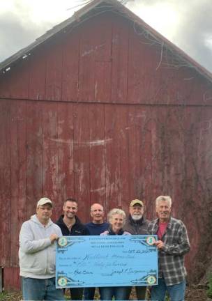 From left are Andy Ciffer, vice president of the East Coast Research &amp; Discovery Association; Michael Van Hooker, Mark Lynch, Sue Lynch and Ron Perez, all of the Friends of Wallisch Homestead; and Joe Jorgensen, president of the ECRDA. (Photo provided)