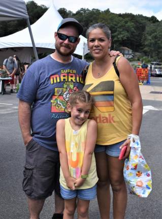 Sean and Millie Coghlan pose with their daughter Isabella.