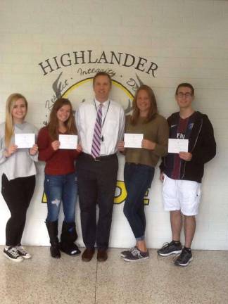 West Milford Township High School Principal Paul Gorski presents a Letter of Commendation from the school and from the National Merit Scholarship Corporation (NMSC) to Commended Students Ally D&#x2019;Angelo, Kayla Yuhas, Audrey Leibig and Nicholas Gangi. Photo provided