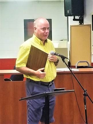 Greg Bailey speaks to the audience at the Aug. 20 meeting.