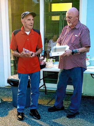 Harry Adams, left, volunteered for seven years, doing a wide variety of jobs. At right is WMASS president Paul Laycox, who has been associated with the nonprofit shelter since 2010.