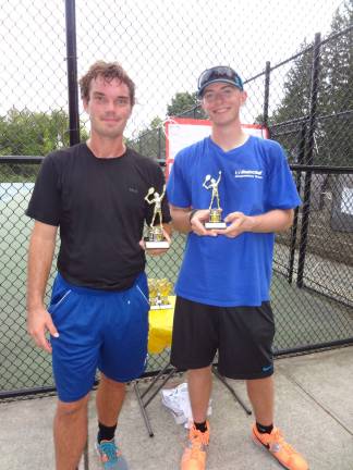 Booster club hosts annual tennis tournament Men's singles champion Peter Barrowclough, left, is seen here with runner-up Rick Mills.
