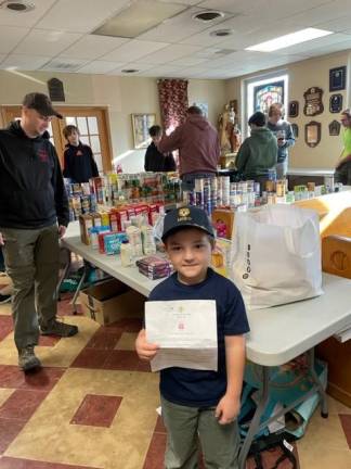 Scouts collect food for church’s pantry