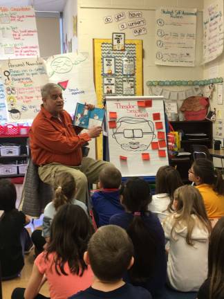 West Milford celebrates 'Read Across America' Steve Drew, a member of the West Milford Board of Education, is seen here reading a favorite Dr. Seuss book at Apshawa Elementary School.