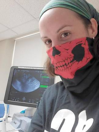 Baby boom or bust? Either way, pregnancy looks different during the coronavirus Dana Marie Becker. Her sonogram is on the screen on the left.