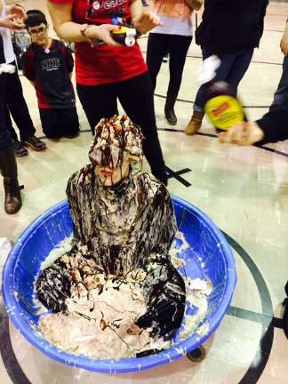 'Principal Sundae' is on the menu at Apshawa The ice cream was put on principal Stephanie Primavera by the students. Teachers and staff got to put the chocolate syrup and cherries on top.