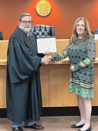 Romano becomes CASA volunteer Hayley Romano of West Milford is sworn in as a volunteer with Court Appointed Special Advocates of Passaic and Union Counties by Superior Court Judge Daniel Yablonsky. (Photo provided)