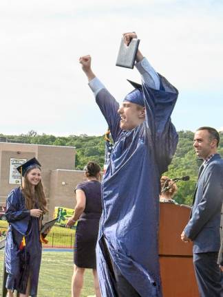 Photos: Jefferson Township High School graduation A graduate celebrates after receiving his diploma.