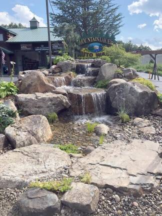 Garden State Koi has just installed a five-foot waterfall at the entrance to Mountain Lakes Autowash, the innovative auto wash and express lube business located at 1946 Union Valley Road in Hewitt. “It is beyond beautiful,” said Hilary Esposito, who has teamed with her husband Peter to operate the family-owned business for more than 16 years. Photo by Susan Levitt.