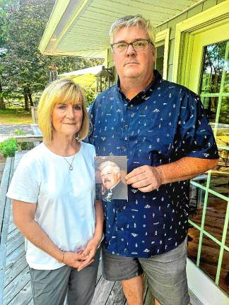 Proud of their service Kendall Kless and Dave Smith with a photo of his father, Steve, who was a U.S. Army helicopter pilot in the Vietnam War. (Photo by Rich Adamonis)