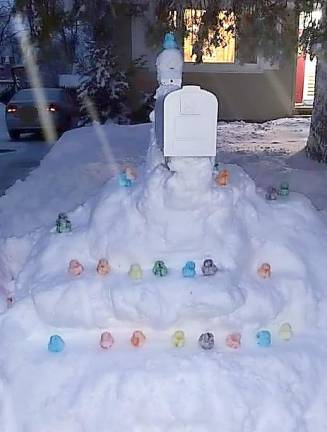 When Christine Lucas came home from a three-day long work shift as a pediatric hospital nurse (due to the snowstorm) ,she was greeted by this display of rainbow-colored duckie snowballs around her mailbox. The creations were made by her children Jess and Aidan to welcome her back home and to brighten her day. Photos provided by Christine Lucas.