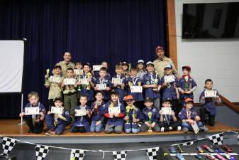 Pinewood Derby winners in Cub Scout Pack 9 pose with Cubmaster Adam Courtney and Assistant Cubmaster Tim Jones. (Photo provided)